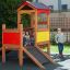 Children playing in Playhouse outdoor playset.