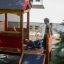 Children playing on the Playhouse wooden slide.