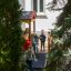 Children playing in a wooden Playhouse in the garden.