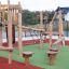 Etna wooden playground climbing structure with ropes and stairs on colorful play area.