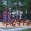 Kalahari wooden playhouse climbing structure with ropes in forest playground