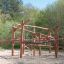 Wooden Sonora playhouse in a natural park environment.