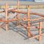 Sonora wooden playground climbing structure with rope net on sandy surface
