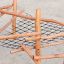Sonora wooden playground climbing structure with rope net on sand surface