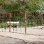 Climbing frame with Ural climbing net on a sandy playground.