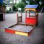 Villa sandbox with a playhouse in a playground setting
