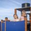 Children playing on Steamboat ship with slide at a playground