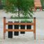 Outdoor playground musical drums in a sandy area.