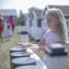 Child playing with outdoor Drums in playground.