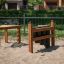 Wooden outdoor Drums set on a sand playground.