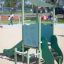 Mars playhouse with slide in a playground.