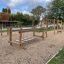 Outdoor playground equipment Trim Trail Nature II with various wooden climbing and balance structure