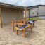 Children's Sand & Water Play area with wooden structures.