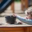 Child playing with Sand & Water Play table