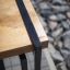 Close-up view of Thor bench made of wood and metal.