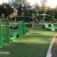 Outdoor fitness playground equipment Ribbon Fitness I placed on green artificial turf.