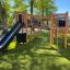 Outdoor playground equipment Challenger Nature II with a slide and climbing structure.