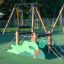Trapezoid with Dragon Claws playground equipment with climbing ropes and green dragon design