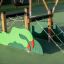Playground climbing structure Trapezoid with Dragon Claws with rope and green dragon design.
