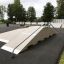 Skate ramps and rails in an outdoor skatepark setting equipped with Fun Box 8.