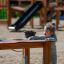 Child playing with Sand & Water Play Table on playground