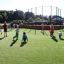 Children playing on a Multiarena Wooden sports field.