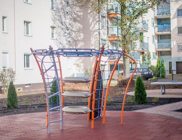 Playground structure on Rubber Tiles 50 in a residential area.