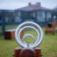 Nature Seesaw playground equipment with circular metal handles on a wooden base.