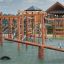 Nature Seesaw wooden playground balancing equipment with rope and rings on safety flooring