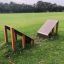 Small Climbing Ramp in a playground on a grassy field.