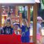 Children playing in a locomotive train playhouse.