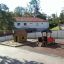 Outdoor locomotive train playhouse for children in a playground.