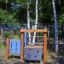 Wooden Captain's Bridge playground equipment in a park.