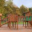 Rope Center on playground made of wood with slides and climbing ropes
