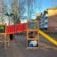 Colorful Jungle castle with slide on a playground.