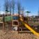 Playground jungle castle with slide in a park.
