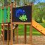 Jungle castle with slide in a playground, featuring chameleon and crocodile decorations.
