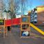 Colorful Jungle castle with slide on a playground.