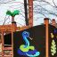 Playground structure Jungle castle with slide featuring colorful snake and jungle decorations.