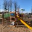 Playground jungle castle with slide in a park.