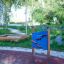Race Track Board playground equipment in a park setting