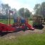 Playground structure shaped like a colorful train and ship named Bus.