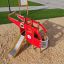 Red Helicopter playground structure with a slide on sand.