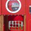 Red children's play structure with helicopter theme and interactive elements