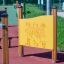 Playground puzzle panel from the Find the Way Board on an outdoor play area.