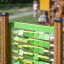 Child playing with Find Pairs Board in an outdoor playground.