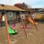 Swing set with All Access Seat on playground.