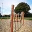 Trim Trail Nature III outdoor wooden climbing structure with ropes in a park setting