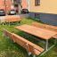 Table & Bench Steel Construction set placed outdoors in a grassy area.