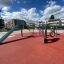 Copernicus steel structure playground equipment with slide and climbing features in a residential ar